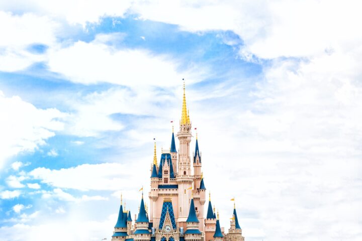 landscape photography of Walt Disney castle under cloudy sky